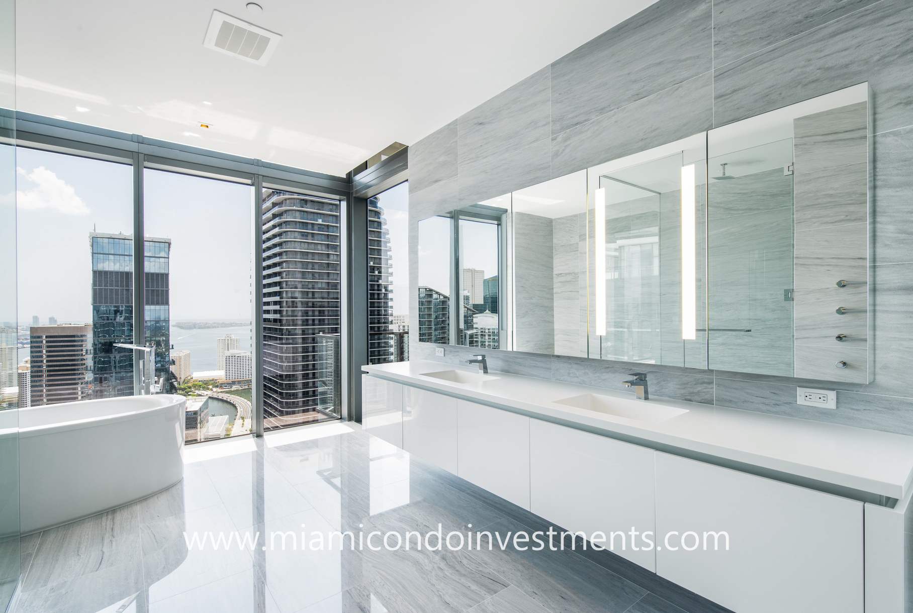 master bathroom with city and water views