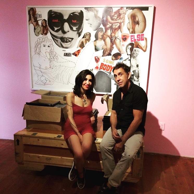Artist Eurydice and Swampspace gallery owner, Oliver Sanchez pose in front of "The Cool Hot Wet Kiss of Somebody Else"