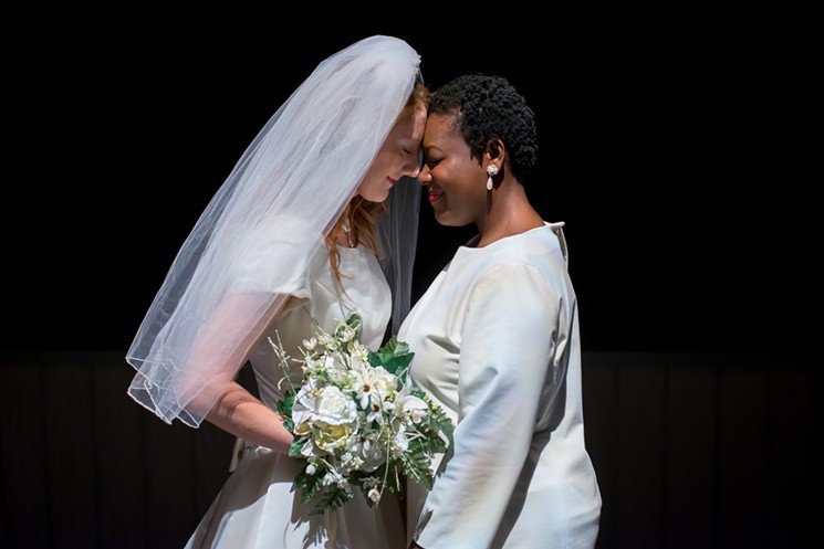Brides Jen (Lexi Langs, left) and Macy (Stephon Duncan) share a tender moment on their wedding day.